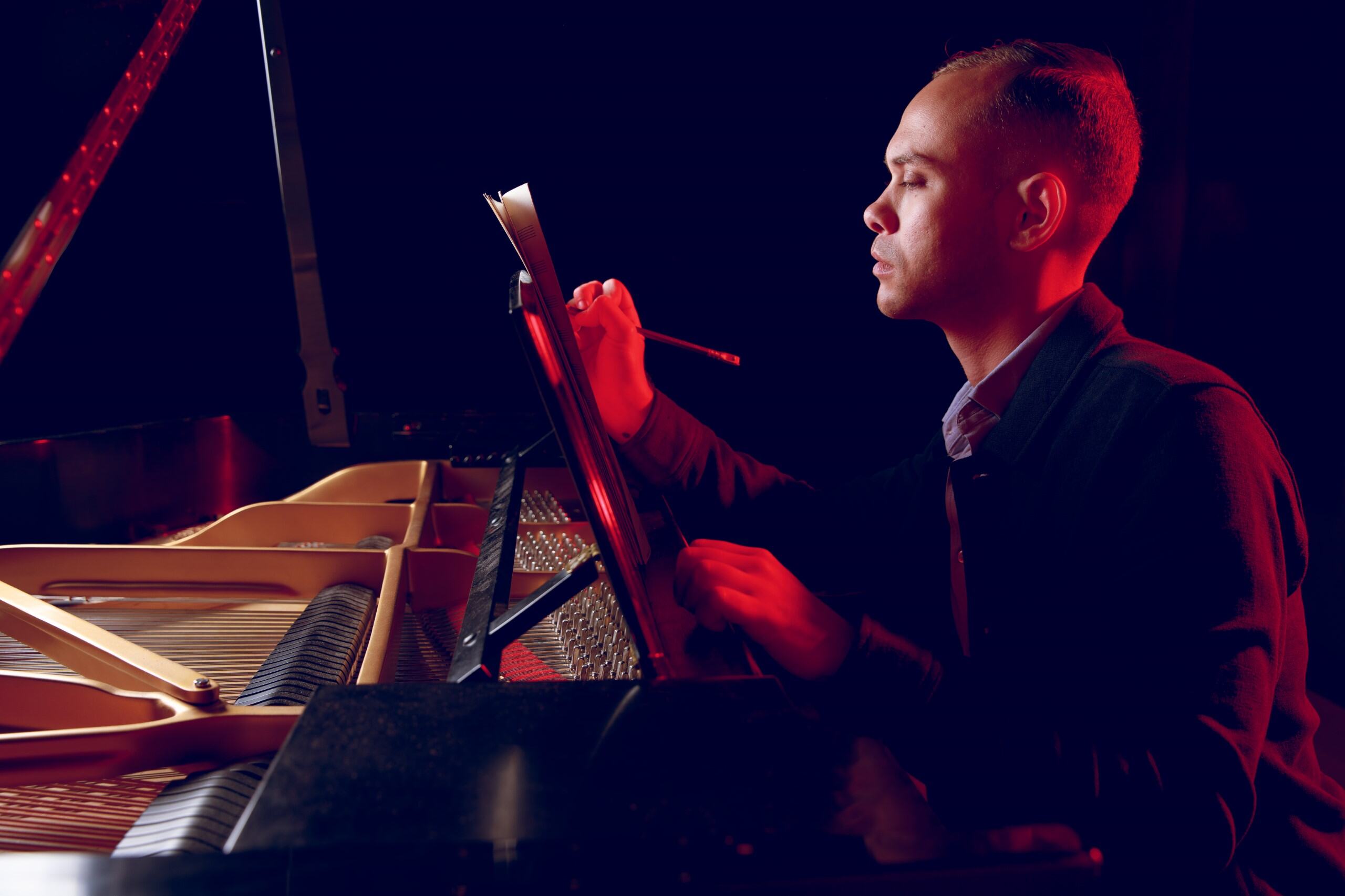 Jeremy Smith writes music at a piano